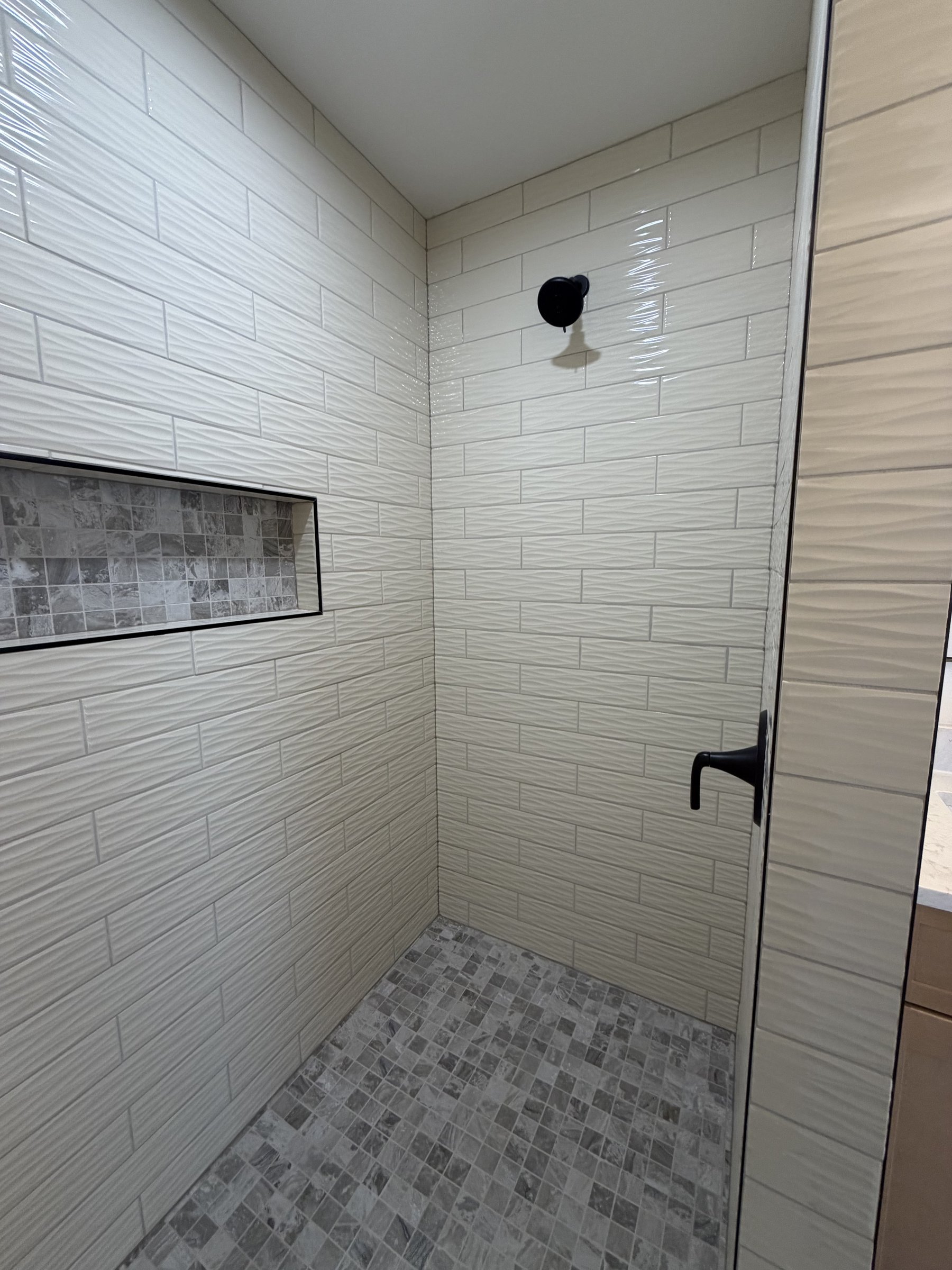 Walk-in shower floor with linear drain