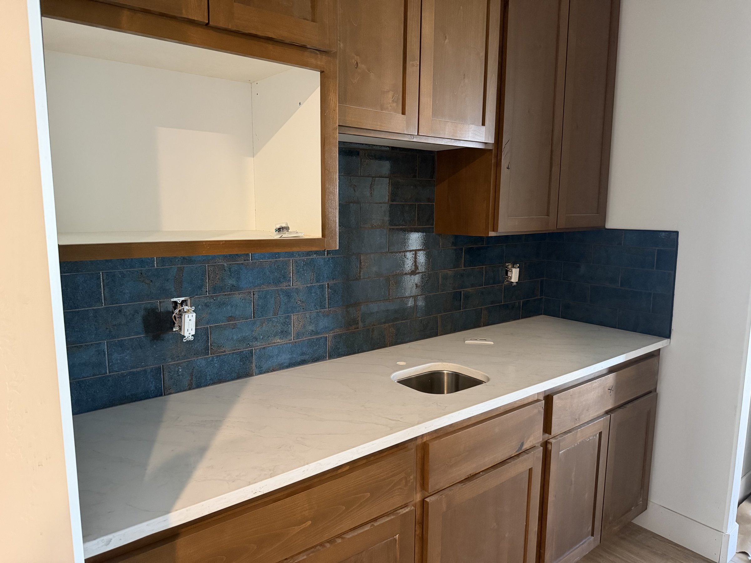 Blue subway tile kitchen backsplash