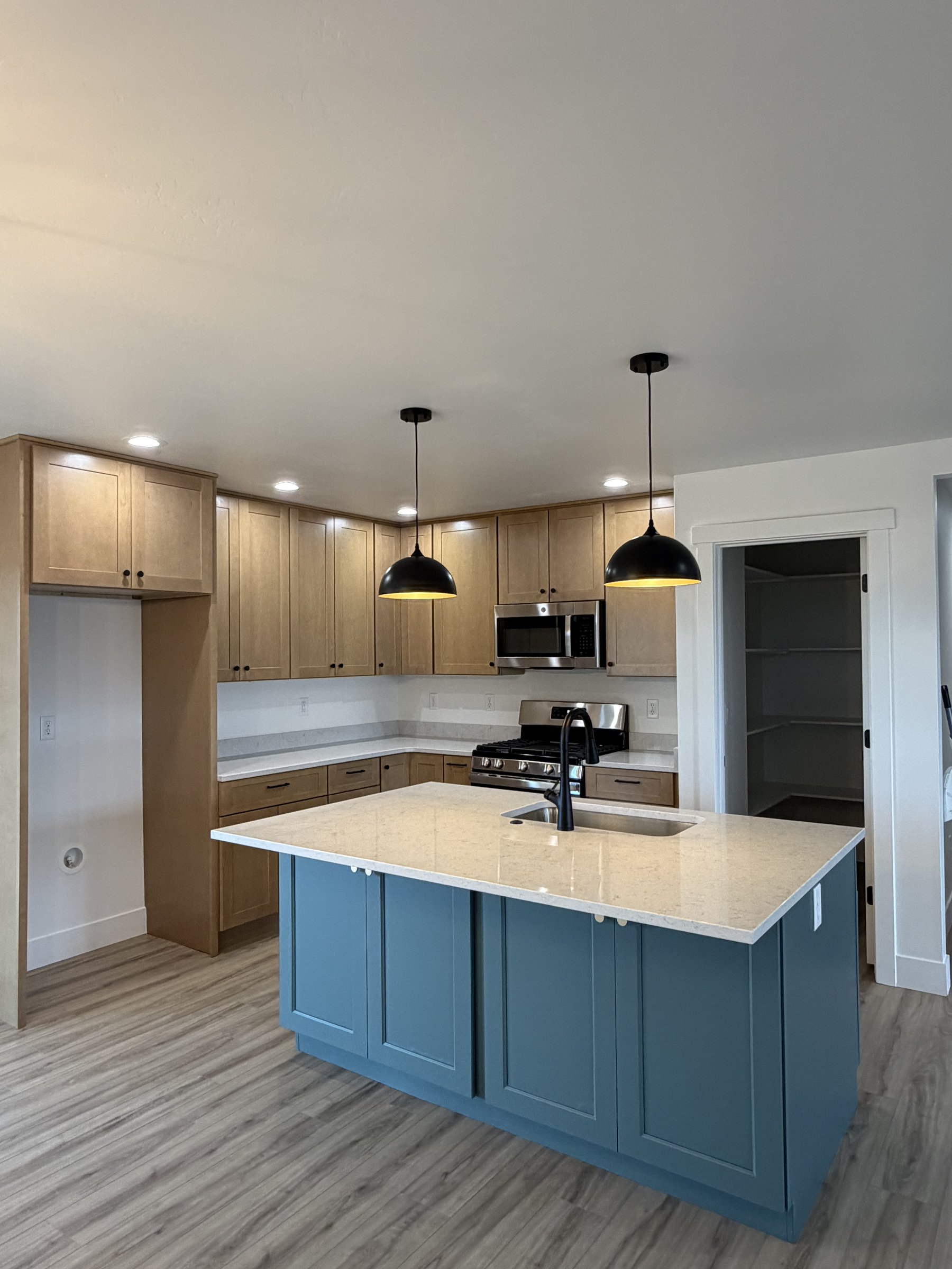 Bright kitchen with blue base cabinets