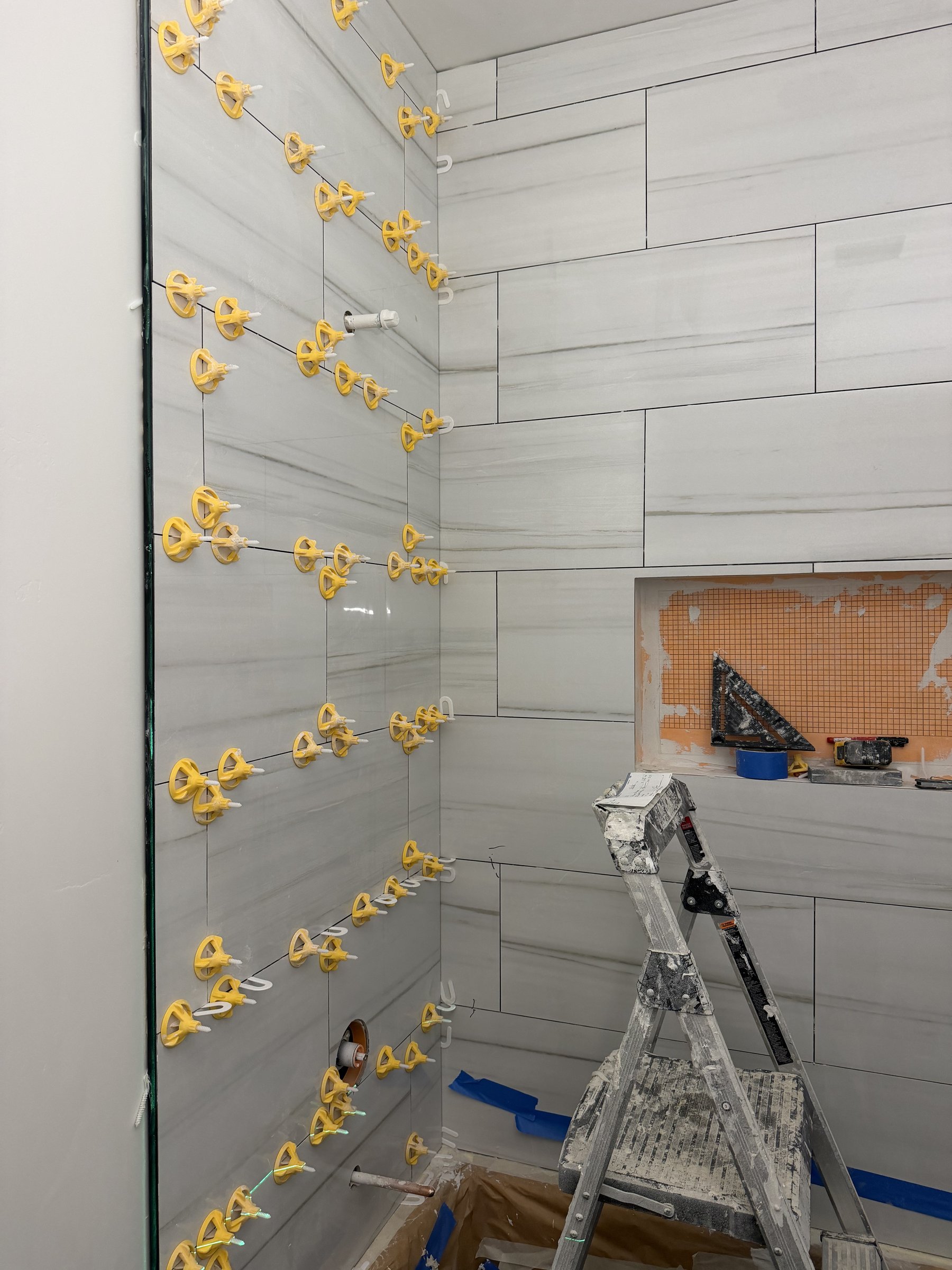 Tile floor install with leveling system